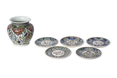 Lot 141 - FIVE POLYCHROME-PAINTED TURKISH KUTAHYA-STYLE POTTERY SAUCERS AND A VASE