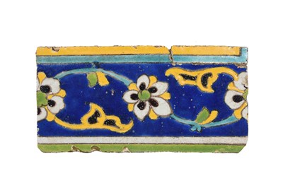 Lot 149 - A SAFAVID CUERDA SECA POTTERY BORDER TILE