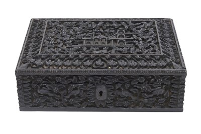 Lot 123 - A DEEPLY CARVED ANGLO-INDIAN EBONY BOX WITH A PALATIAL SETTING AND VEGETATION