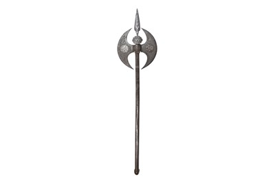 Lot 214 - A QAJAR ENGRAVED SILVER-INLAID STEEL AXE (TABAR)