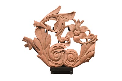 Lot 136 - A CARVED MOTTLED RED SANDSTONE DECORATIVE FRIEZE WITH FLOWERS