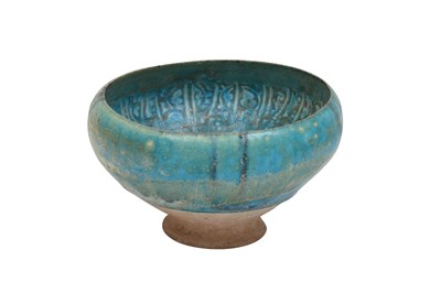 Lot 256 - A BAMIYAN MONOCHROME TURQUOISE-GLAZED POTTERY BOWL WITH KUFIC CALLIGRAPHY