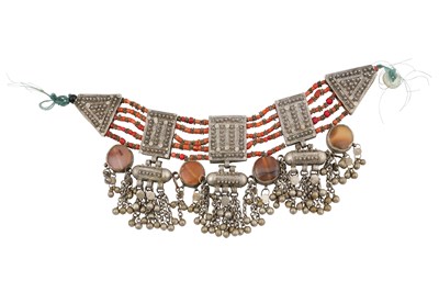 Lot 57 - A YEMENI NECKLACE (IQD) WITH RED CORAL BEADS, SILVER HIRZ AND RED AGATE PENDANTS