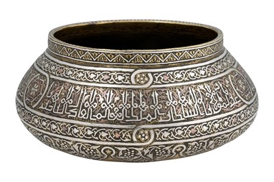Lot 194 - A MAMLUK REVIVAL DAMASCUS-WARE COPPER AND SILVER-INLAID BRASS BOWL