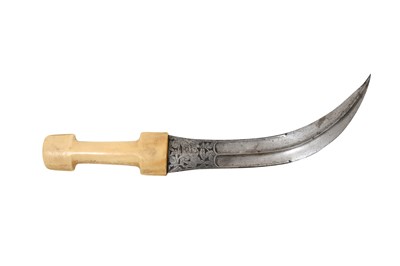 Lot 213 - λ A QAJAR WALRUS IVORY-HILTED KHANJAR STEEL DAGGER