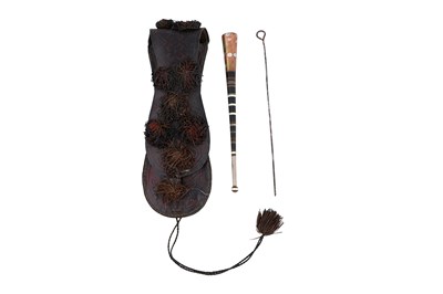 Lot 4 - λ A PORTABLE TUAREG LEATHER CASE WITH SMOKING ACCESSORIES