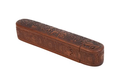 Lot 228 - A QAJAR CARVED FRUITWOOD QALAMDAN (PEN CASE)