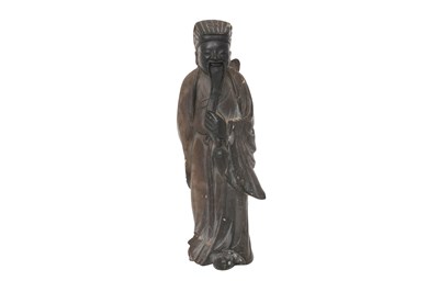 Lot 73 - A CHINESE SOAPSTONE FIGURE OF AN IMMORTAL