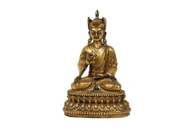 Lot 108 - A SINO-TIBETAN GILT-BRONZE FIGURE OF GURU RINPOCHE, PADMASAMBHAVA