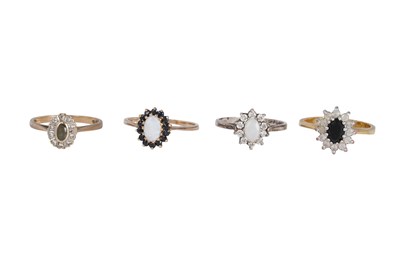 Lot 6 - FOUR GOLD AND SILVER HALO RINGS