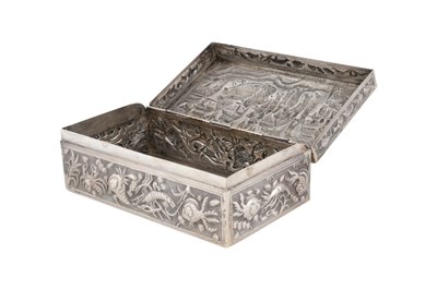 Lot 249 - A SILVER BURMESE REPOUSSÉ BOX WITH PROCESSION SCENE
