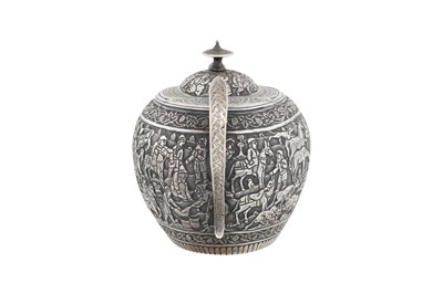 Lot 238 - AN UNMARKED IRANIAN (PERSIAN) THREE-PIECE SILVER TEA SET
