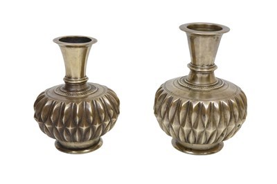 Lot 6 - A NEAR PAIR OF INDIAN HIGH-TIN GADROONED METAL BOTTLES WITH DIAMOND-SHAPED PATTERN