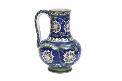Lot 261 - AN IZNIK-STYLE POTTERY JUG WITH ROSETTES AND SAZ LEAVES