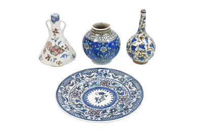 Lot 254 - FOUR POLYCHROME-PAINTED QAJAR POTTERY VESSELS WITH VEGETAL AND FLORAL MOTIFS