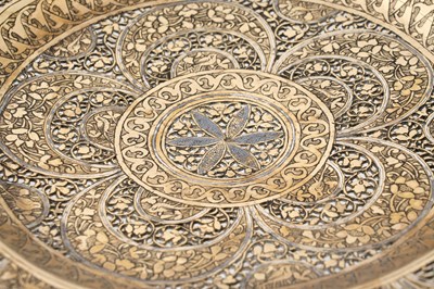 Lot 200 - A QAJAR OPENWORK SILVER-INLAID BRASS DISH