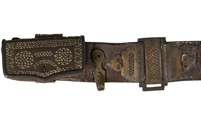 Lot 215 - A SAFAVID LEATHER BELT WITH STEEL BUCKLE AND OPENWORK BRASS FITTINGS