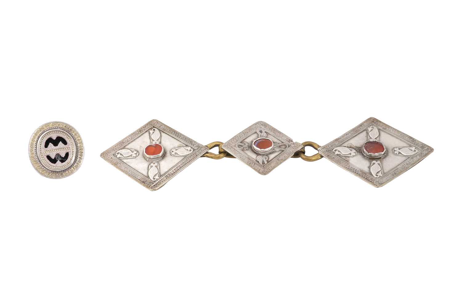 Lot 218 - A KAZAKH PARCEL-GILT SILVER RING AND A CARNELIAN-SET SILVER BELT BUCKLE