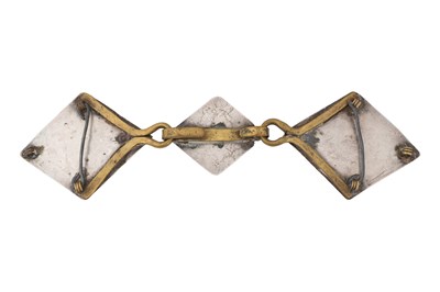 Lot 218 - A KAZAKH PARCEL-GILT SILVER RING AND A CARNELIAN-SET SILVER BELT BUCKLE