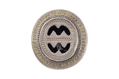 Lot 218 - A KAZAKH PARCEL-GILT SILVER RING AND A CARNELIAN-SET SILVER BELT BUCKLE