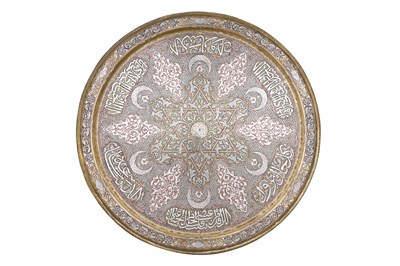 Lot 193 - A MAMLUK-REVIVAL DAMASCUS-WARE SILVER AND COPPER-INLAID BRASS OCCASIONAL TABLE