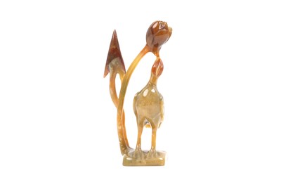 Lot 8 - A CHINESE AGATE AND A SERPENTINE CARVING AND A FAMILLE ROSE STEM BOWL