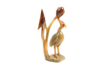 Lot 8 - A CHINESE AGATE AND A SERPENTINE CARVING AND A FAMILLE ROSE STEM BOWL