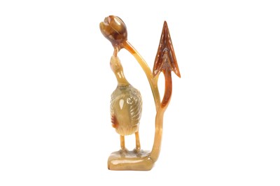 Lot 8 - A CHINESE AGATE AND A SERPENTINE CARVING AND A FAMILLE ROSE STEM BOWL