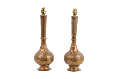 Lot 53 - A PAIR OF INDIAN BRASS VASES MOUNTED AS LAMPS