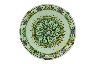 Lot 73 - AN IZNIK POTTERY DISH