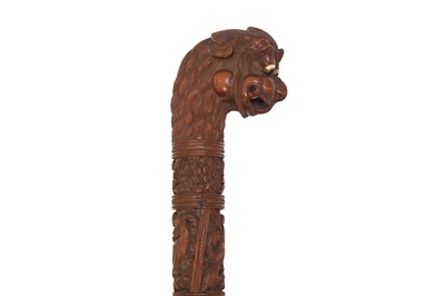 Lot 122 - A CARVED SANDALWOOD WALKING CANE WITH VYALA HEAD