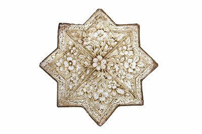 Lot 233 - A COPPER LUSTRE-PAINTED KASHAN-REVIVAL STAR-SHAPED POTTERY TILE