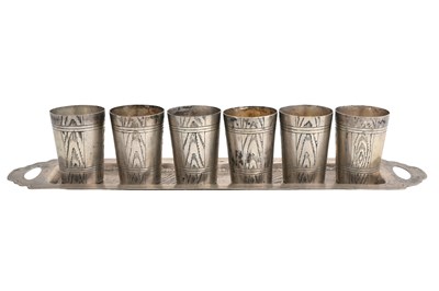 Lot 8 - A SET OF SIX RUSSIAN WHITE METAL SHOT GLASSES ON AND TRAY