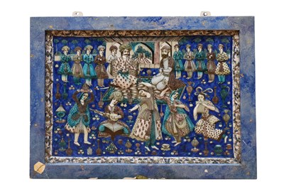Lot 206 - A LARGE POLYCHROME-PAINTED MOULDED QAJAR POTTERY TILE WITH A COURTLY BANQUET SCENE