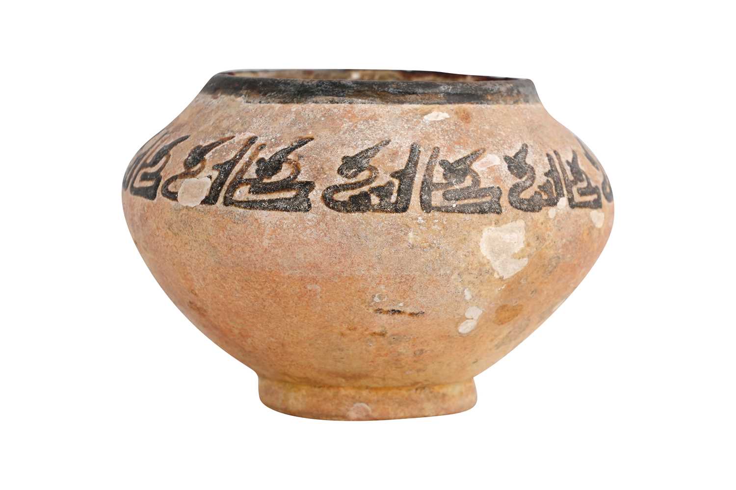 Lot 3 - A NISHAPUR POTTERY BOWL WITH KUFIC CALLIGRAPHY