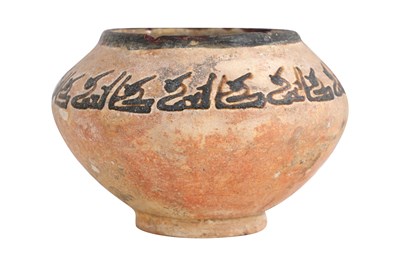 Lot 3 - A NISHAPUR POTTERY BOWL WITH KUFIC CALLIGRAPHY
