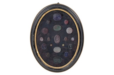 Lot 2 - A FRAMED SET OF 18TH/19TH CENTURY COLOURED GLASS INTAGLIOS OR 'TASSIE GEMS'