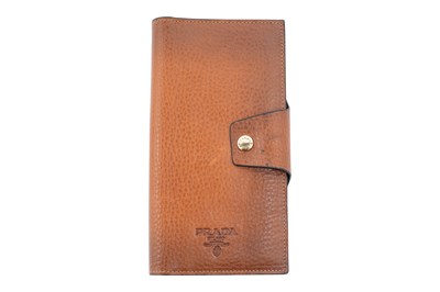 Lot 143 - A PRADA GRAINED TANNED LEATHER CONTINENTAL WALLET