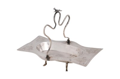 Lot 185 - A SILVER FOUR-FOOTED IRAQI TRAY WITH CURVED HANDLE