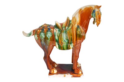 Lot 197 - A LARGE SANCAI GLAZED TANG DYNASTY STYLE POTTERY FIGURE OF A HORSE