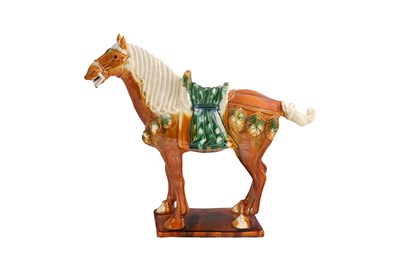 Lot 198 - A LARGE SANCAI GLAZED TANG DYNASTY STYLE POTTERY FIGURE OF A HORSE