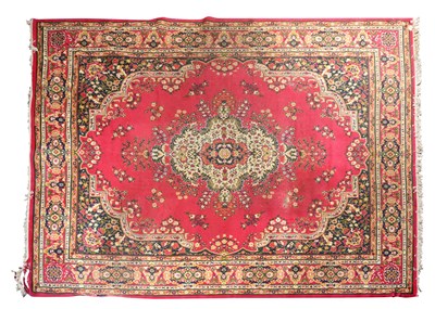 Lot 104 - A RED GROUND TABRIZ CARPET