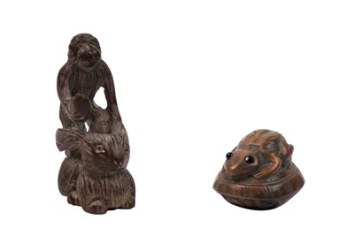 Lot 66 - TWO JAPANESE CARVED WOODEN NETSUKE