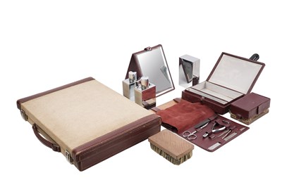 Lot 169 - AN HERMÈS BEIGE CANVAS AND BROWN LEATHER GENTLEMAN'S GROOMING CASE