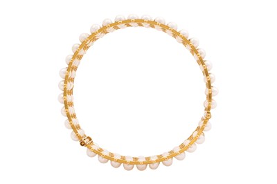 Lot 73 - A GOLD AND PEARL HINGED CUFF BRACELET