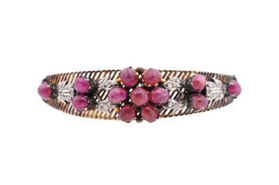 Lot 74 - A 14CT GOLD RUBY AND DIAMOND BANGLE