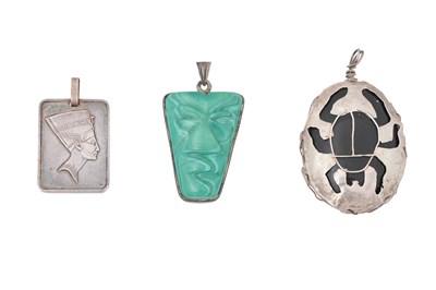 Lot 232 - AN EGYPTIAN REVIVAL SILVER PENDANT COLLECTION (3)