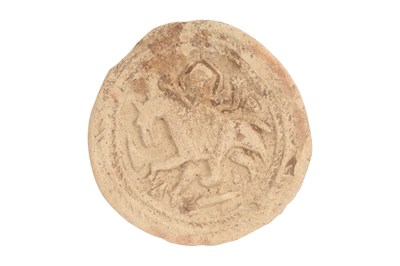 Lot 130 - A RARE ABBASID CLAY MOULDED SEAL WITH HORSE AND RIDER