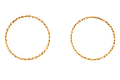 Lot 79 - A PAIR OF GOLD ROPE TWIST BANGLES