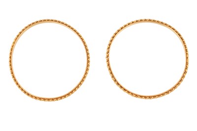 Lot 80 - A PAIR OF GOLD, GADROONED BANGLES